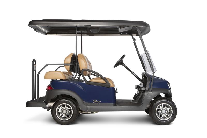 Seitliche Ansicht eines Golfcart mit 4 Sitzplätzen, Dach und Scheibe. 2 Plätze sind entgegen der Fahrtrichtung.